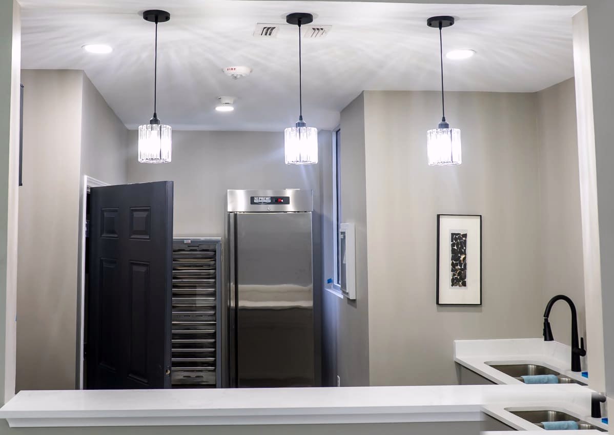 Onyx Event Center — catering counter with crystal pendant lighting